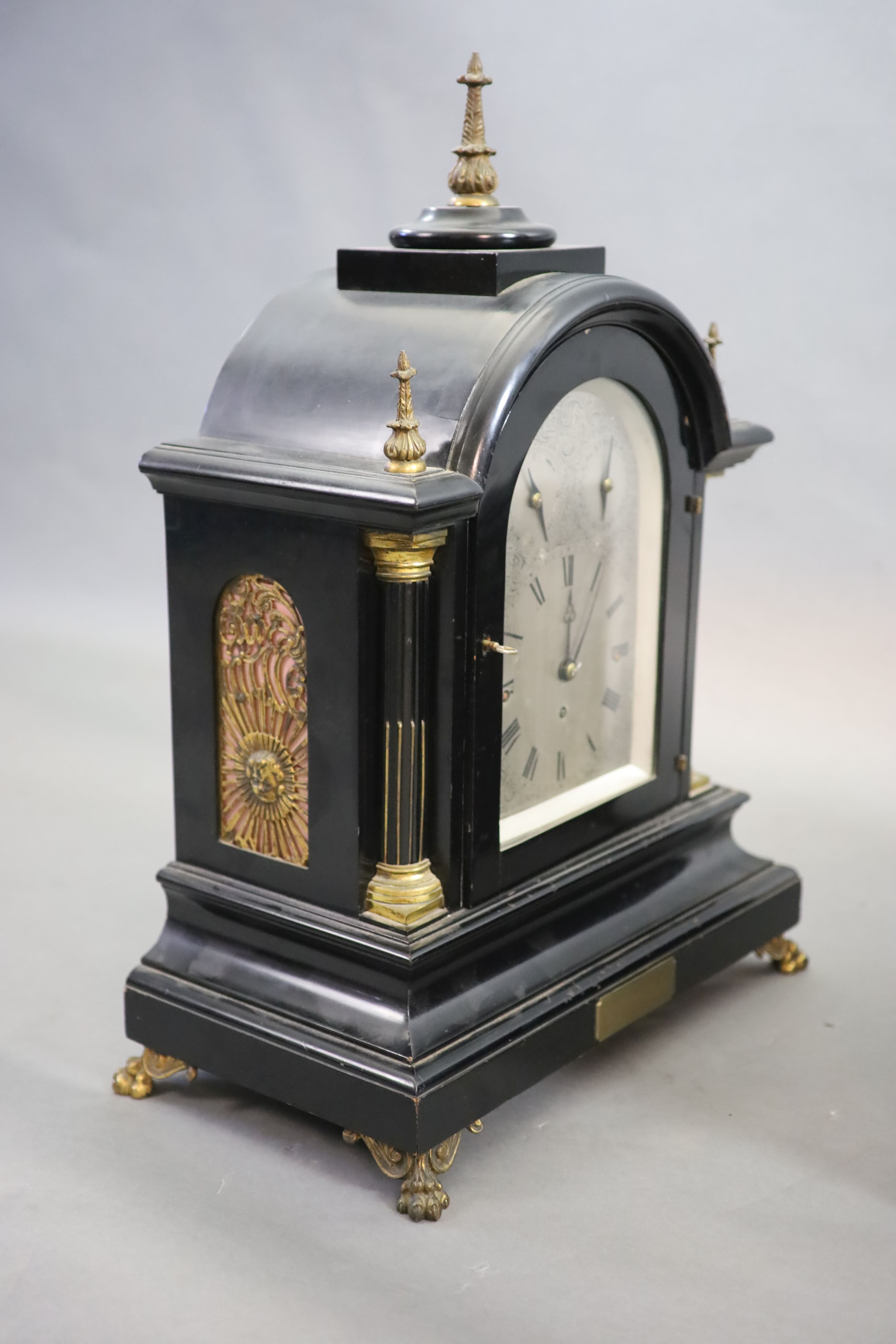 A large late Victorian ebonised bracket clock with bracket